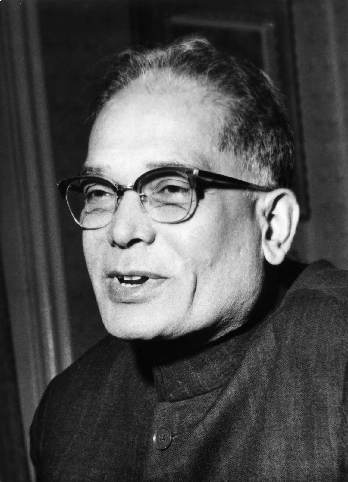 Portrait photograph of Jaya Prakash Narayan in spectacles and a dark kurta, speaking